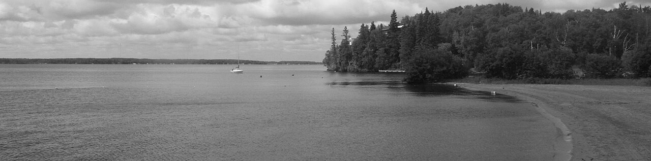 Panorama of Falcon Lake itself — the township is the case's permanent geographic anchor, with a UFO-themed Canadian commemorative coin minted by the Royal Canadian Mint in 2018.