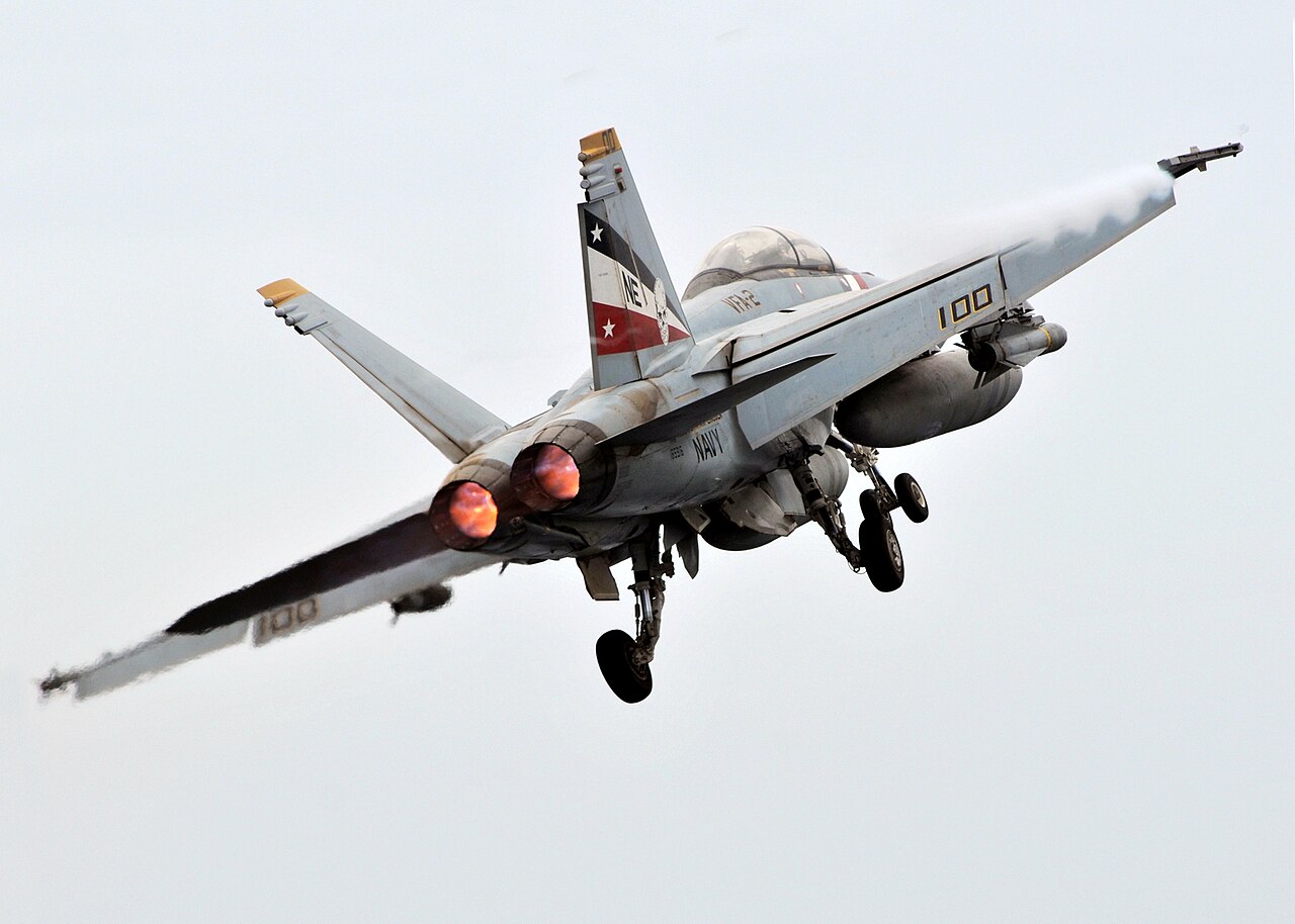 An F/A-18F launching from a carrier — the deployment posture from which the VFA-11 'Red Rippers' fighter squadron pilots captured the Gimbal and Go Fast footage on the same January 2015 sortie.