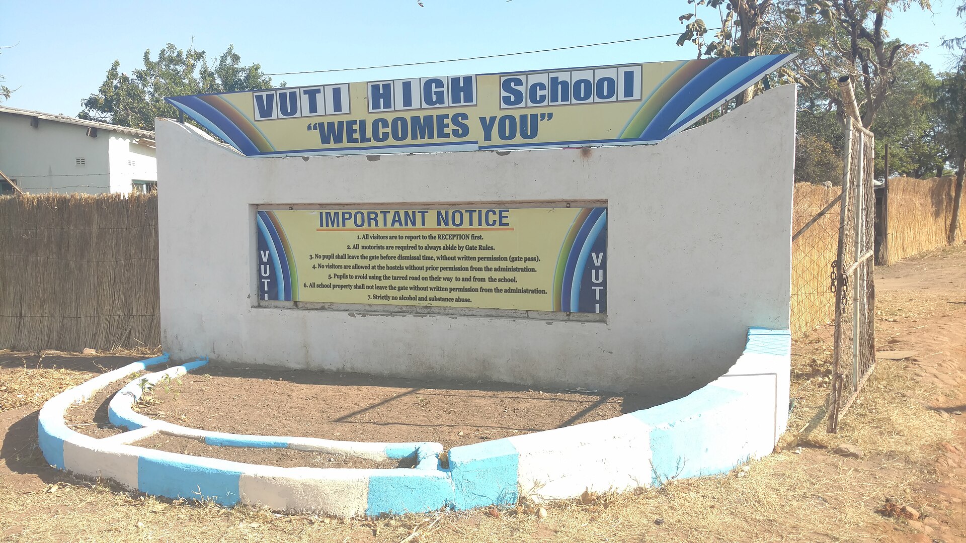 A Zimbabwean school entrance sign — illustrative of the rural-school setting of the Ariel School incident. On 16 September 1994, 62 children at the Ariel School in Ruwa, outside Harare, reported a small craft and beings with large black eyes that walked toward them through the playground.