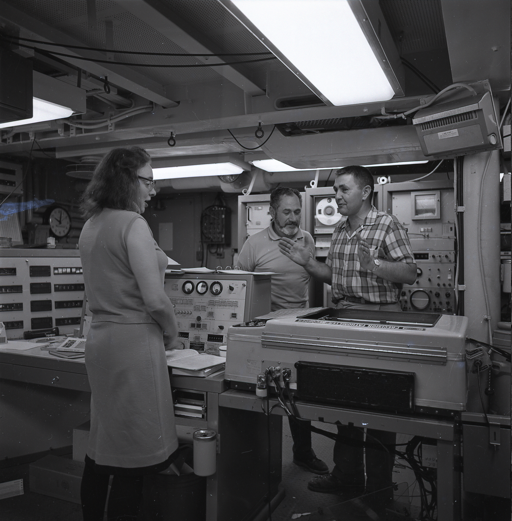Marie Tharp at Lamont-Doherty. Her bathymetric maps transformed plate tectonics from contested hypothesis to scientific consensus. Bob Ballard, who used her work to locate hydrothermal vents and the Titanic, stands at her left.