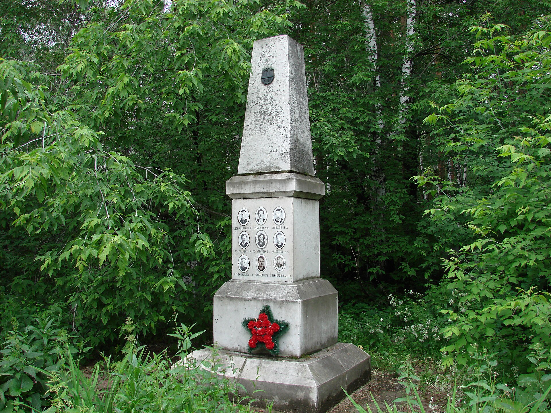 The memorial to the Dyatlov group at Mikhailovskoe Cemetery, Yekaterinburg. The pass — Otorten ridge in the Northern Urals — was renamed Dyatlov Pass in 1959. Soviet authorities sealed the case file as 'an unknown compelling force.'