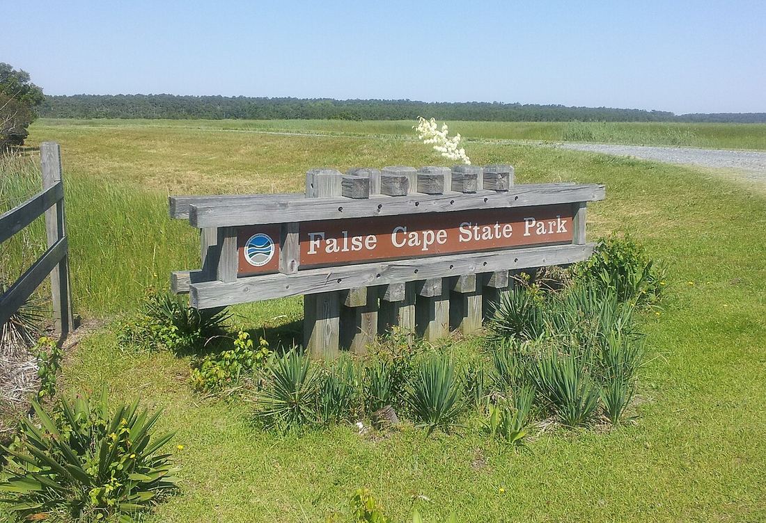 Entrance sign — the park is accessible only by foot, bicycle, or boat.