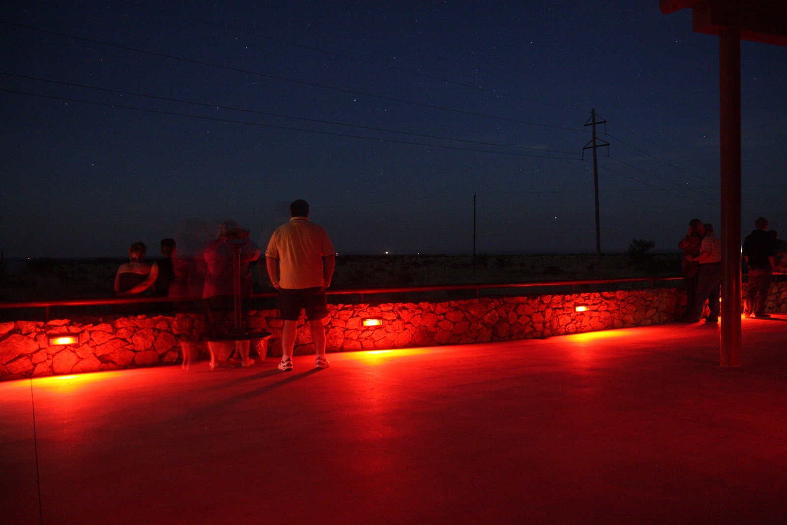 The viewing platform at dusk. The lights typically appear after sunset, hovering at ground level somewhere in the Chinati Mountains to the southwest.