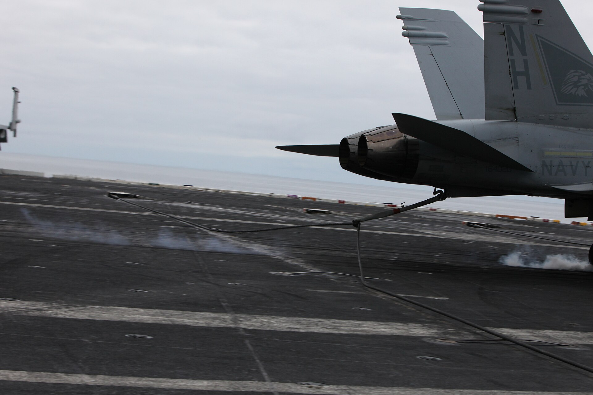 An F-18 Super Hornet landing on USS Nimitz — type of the aircraft Fravor flew during the encounter. The 'FLIR1' video footage was confirmed authentic by the Pentagon in 2017 and reissued as 'official' by the Department of Defense in 2020.