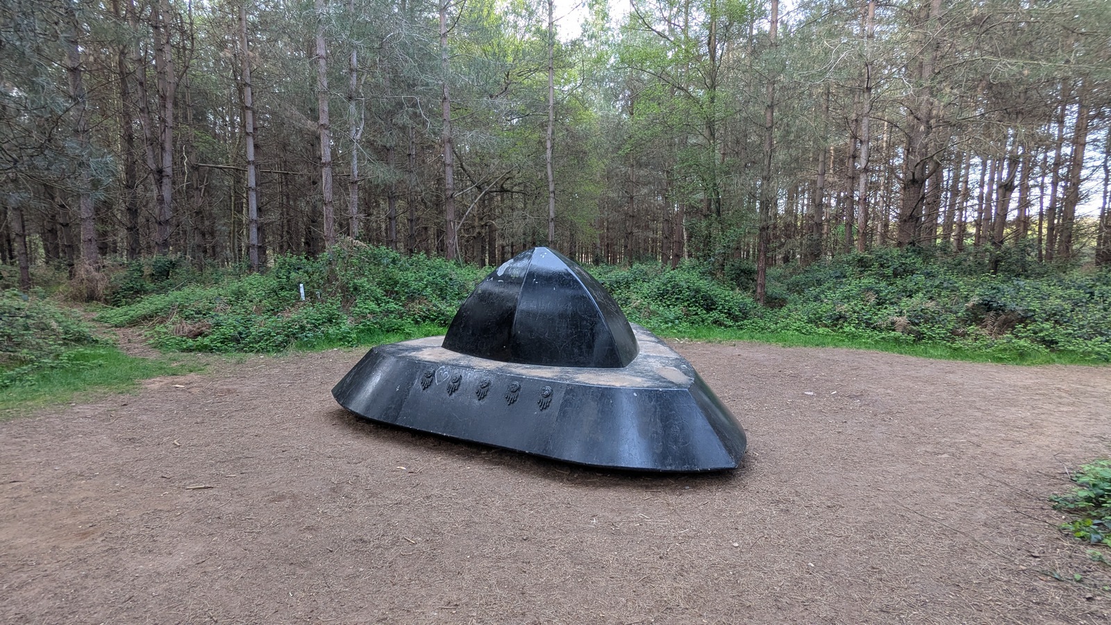 The UFO sculpture along the Rendlesham Forest UFO Trail — a Forestry Commission-built waymarker on the path through the woodland where Sergeant Jim Penniston says he touched a glowing triangular craft on 26 December 1980.