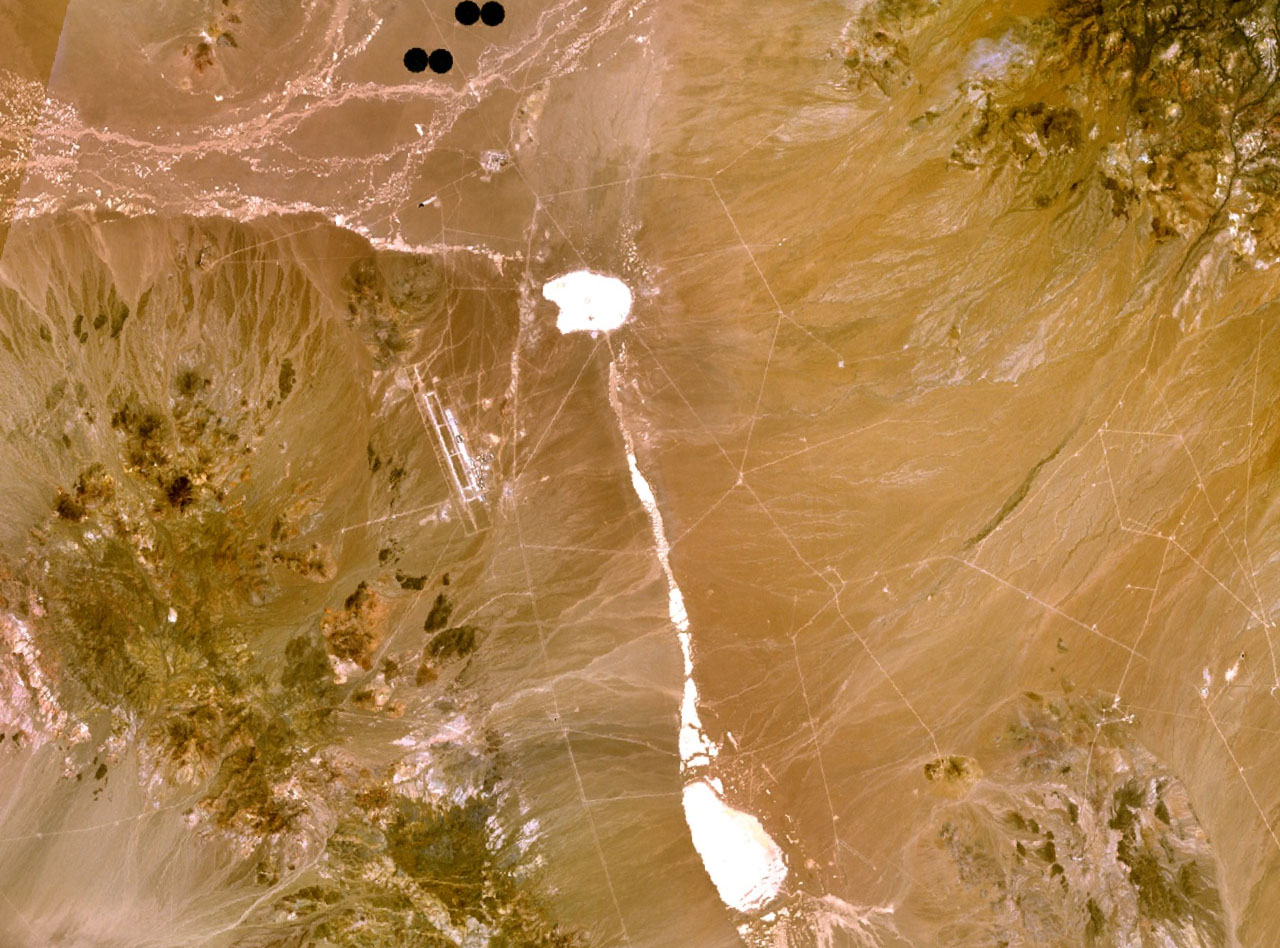 The lone runway at Tonopah, photographed from low altitude. The hangars at the south end held the stealth fleet from 1982 to 1992.